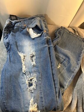 Distressed Blue Denim Jeans